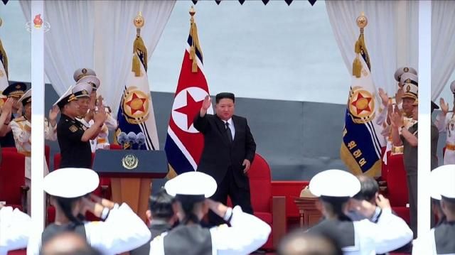 North Korean leader Kim Jong-un center attends a commissioning ceremony for a new destroyer at a port in Nampo on June 23 2026 in this photo released by the state-run North Korean Central News Agency the following day