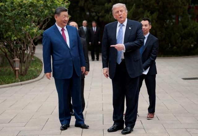 US President Donald Trump gestures towards Chinese President Xi Jinping while leaving after a visit to the Zhongnanhai Garden in Beijing China May 15 2026 Reuters-Yonhap 