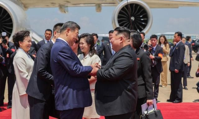 North Korean leader Kim Jong-un right shakes hands with Chinese President Xi Jinping at Pyongyang Sunan International Airport on June 8 2026 in this photo released by the state-run North Korean Central News Agency KCNA the following day