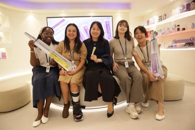 MaryMays global team members pose with the skincare brands products at its Seoul office on Sept 16 2026 Dongbang TV Zhang Bin