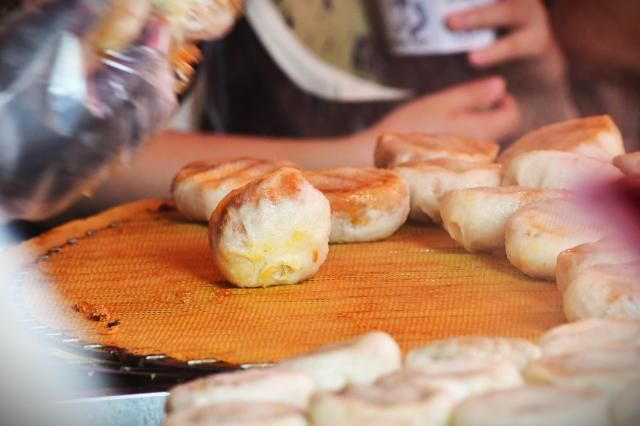 Freshly steamed dumplings mandu are prepared at a street food stall inside Namdaemun Market in central Seoul Sept 22 2026 AJP Joonha Yoo