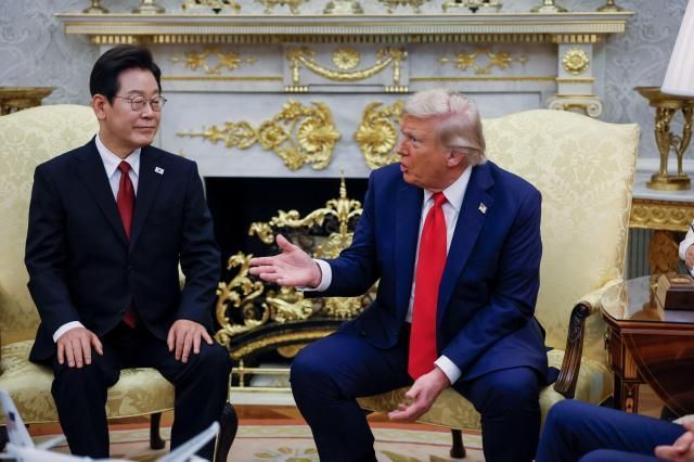 President Lee Jae Myung left and US President Donald Trump hold a summit meeting at the White House on July 25 Reuters-Yonhap