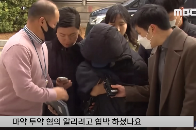 ▲아이를 안고 나타난 A씨 (사진=MBC 뉴스)