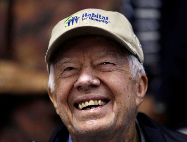 FILE PHOTO: Former U.S. President Jimmy Carter attends a Habitat for Humanity home building site in the Ivy City neighborhood of Washington, U.S. October 4, 2010. REUTERS/Larry Downing/File Photo