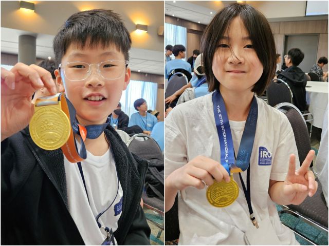 인천 은송초등학교 4학년 강수호군(왼쪽)과 명선초등학교 4학년 윤제니양이 호주 국제 로봇 올림피아드 세계대회 크리에이티드 무비 종목에서 금상을 수상하고 기념 촬영을 하고 있다. 브레인미션 제공
