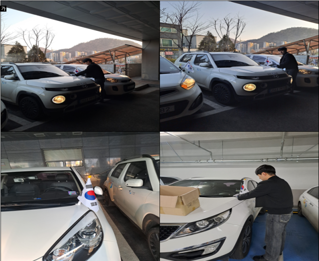 가평군 직원이 공용차량에 태극기를 달고 있다. 가평군 제공