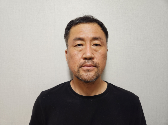 스토킹하던 여성을 살해한 뒤 달아났다 나흘 만에 붙잡힌 윤정우(48). 대구경찰청 제공