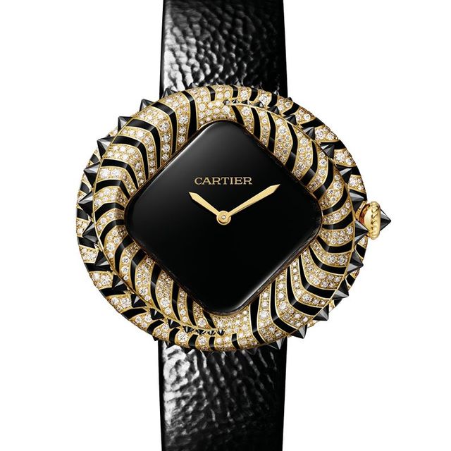 블랙 스피넬과 브릴리언트 컷 다이아몬드를 세팅한 케이스가 돋보이는 옐로골드 애니멀 주얼리 워치. 