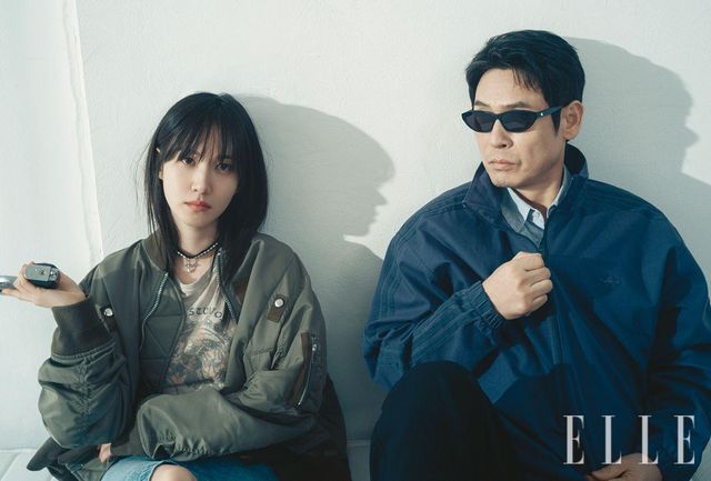 박은빈이 입은 카키 블루종은 Sacai. 이너 웨어 티셔츠는 Acne Studios. 블랙초크는 Vivienne Westwood. 데님 스커트는 Alessandra Rich. 설경구가 입은 네이비 점퍼는 Adidas. 이너 웨어 셔츠는 From Arles. 팬츠는 Studio Tomboy. 선글라스는 Blue Elephant. 