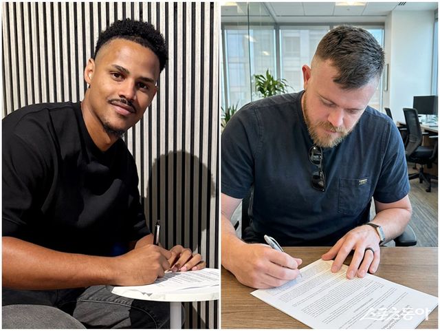 엘빈 로드리게스(왼쪽)와 제레미 비슬리가 롯데와 계약서에 서명하고 있다. 사진제공｜롯데 자이언츠