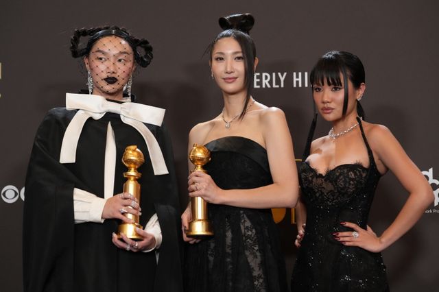 Audrey Nuna, from left, EJAE, and Rei Ami pose in the press room with the award for best original song ? motion picture for “Golden” from “Kpop Demon Hunters” during the 83rd Golden Globes on Sunday, Jan. 11, 2026, at the Beverly Hilton in Beverly Hills, Calif. (AP Photo/Chris Pizzello)