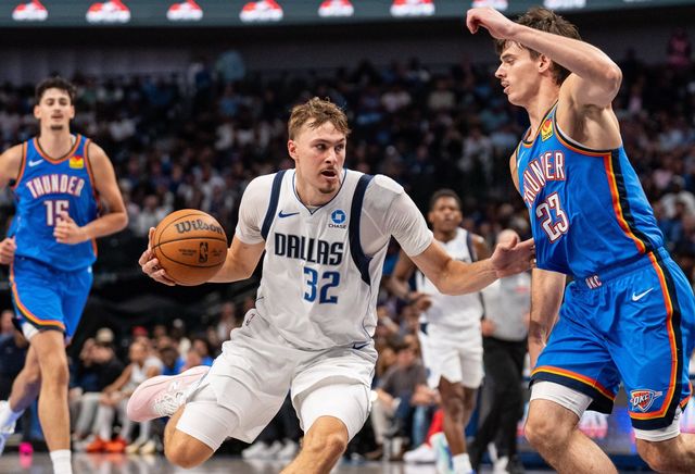 Dallas Mavericks forward Cooper Flagg drives against Oklahoma City Thunder forward Brooks Barnhizer during the second half of an NBA basketball game Wednesday, Oct. 28, 2026, in Dallas. (AP Photo/Jeffrey McWhorter)