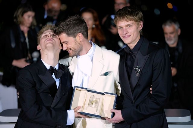 Valentin Campagne, from left, director Lukas Dhont and Emmanuel Macchia, winners of the award for best actor for ‘Coward,’ poses for photographers at the awards ceremony photo call during the 79th international film festival, Cannes, southern France, Saturday, May 23, 2026. (AP Photo/John Locher)